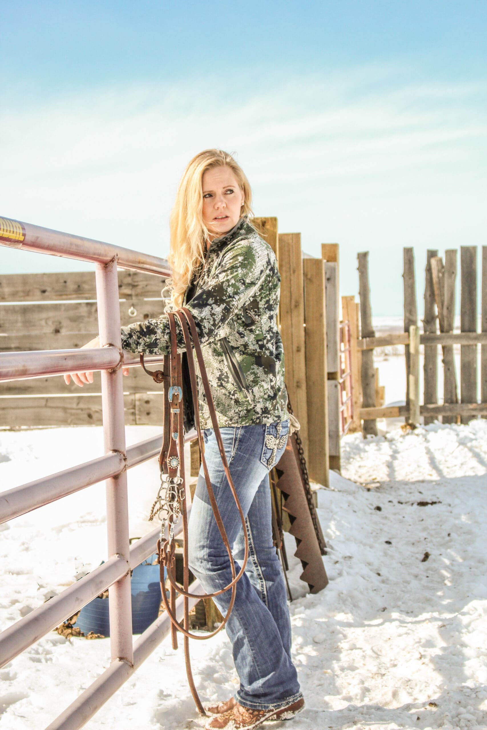 Laura Michielsen standing on her snowy Alberta farm, owner of Top Shelf Maine Coons.